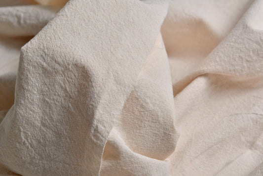 Close-up texture of undyed plain woven cotton fabric for natural dye projects