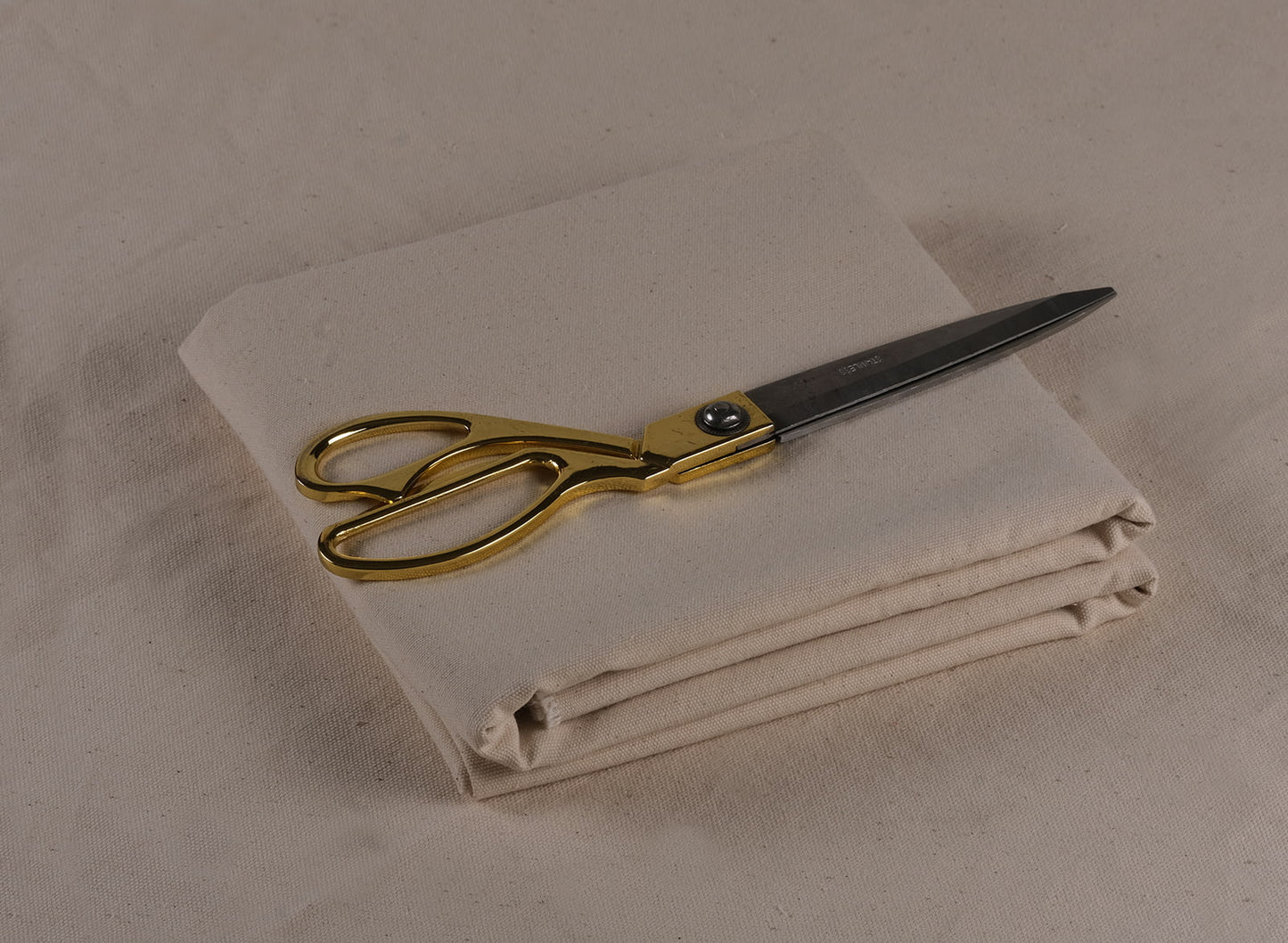 Undyed 100% cotton canvas fabric, 250 gsm, folded and ready for natural dyeing and textile projects