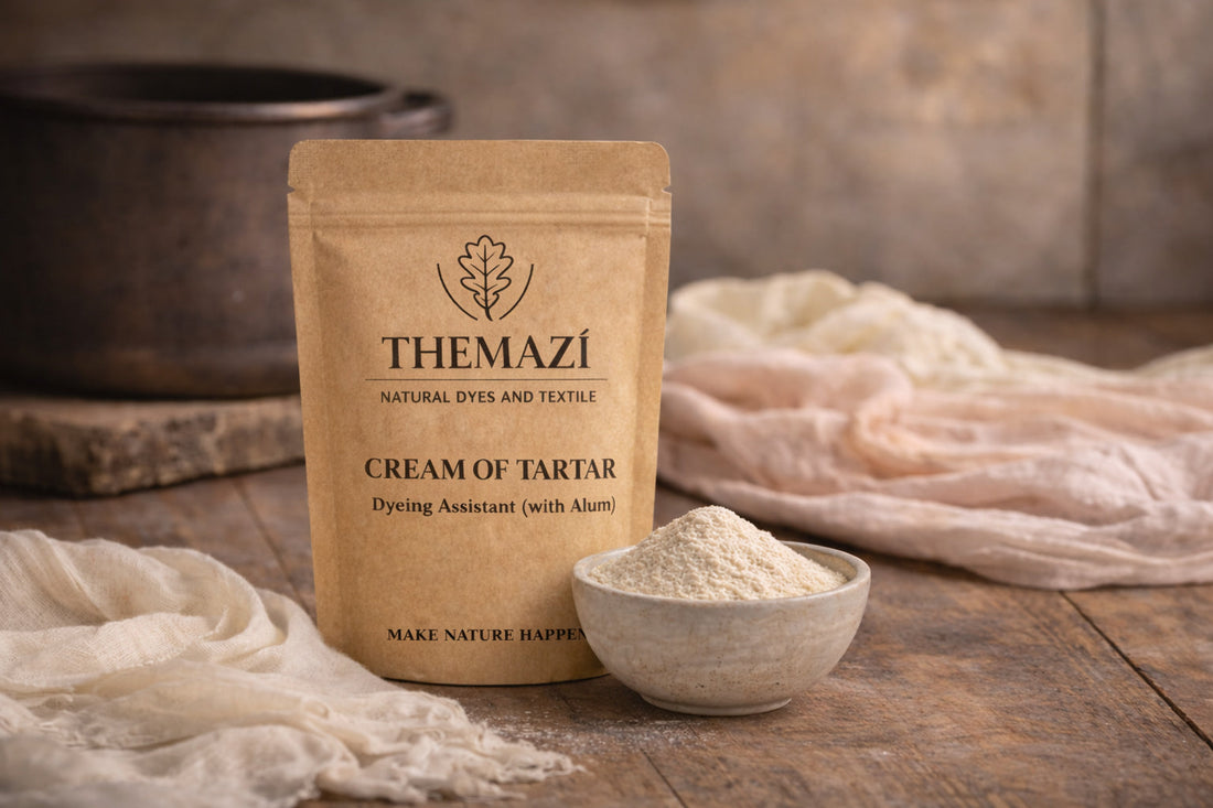 TheMazi Cream of Tartar dyeing assistant (with alum) with natural dyeing tools, fabric and a bowl of powder on a studio table