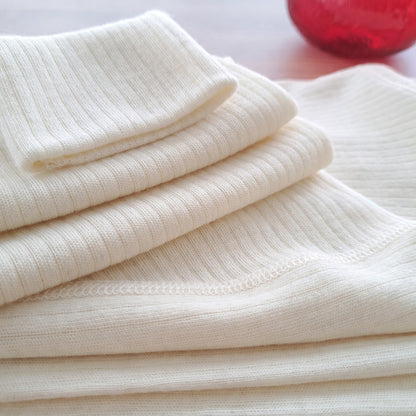 Undyed merino wool fabric texture close up chemical free