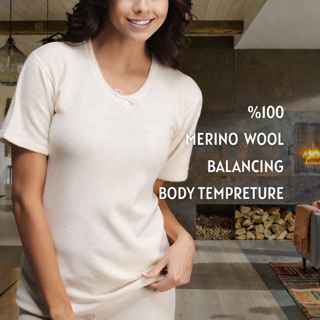Female model wearing 100% merino wool ribbed short sleeve base layer with thermal balancing feature