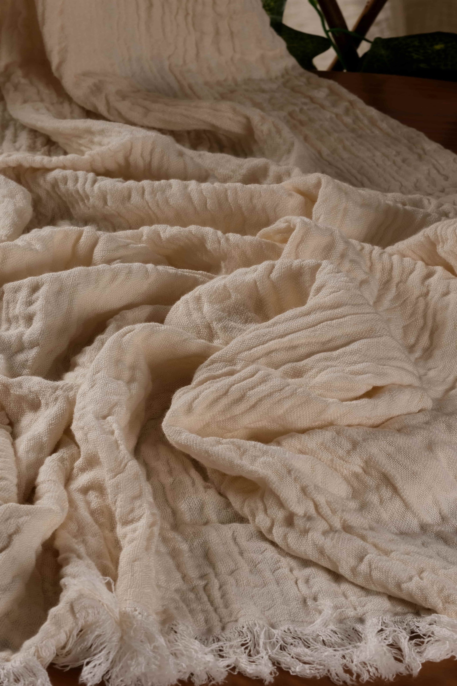 Close-up of the soft, crinkled texture of a handwoven Buldan towel made with cotton and tencel fibers.