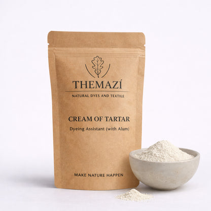 TheMazi Cream of Tartar dyeing assistant (with alum) in kraft pouch with a bowl of white powder on a studio background
