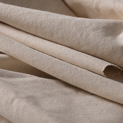 Close-up texture of untreated cotton canvas fabric suitable for natural dyeing, printing, and craft use