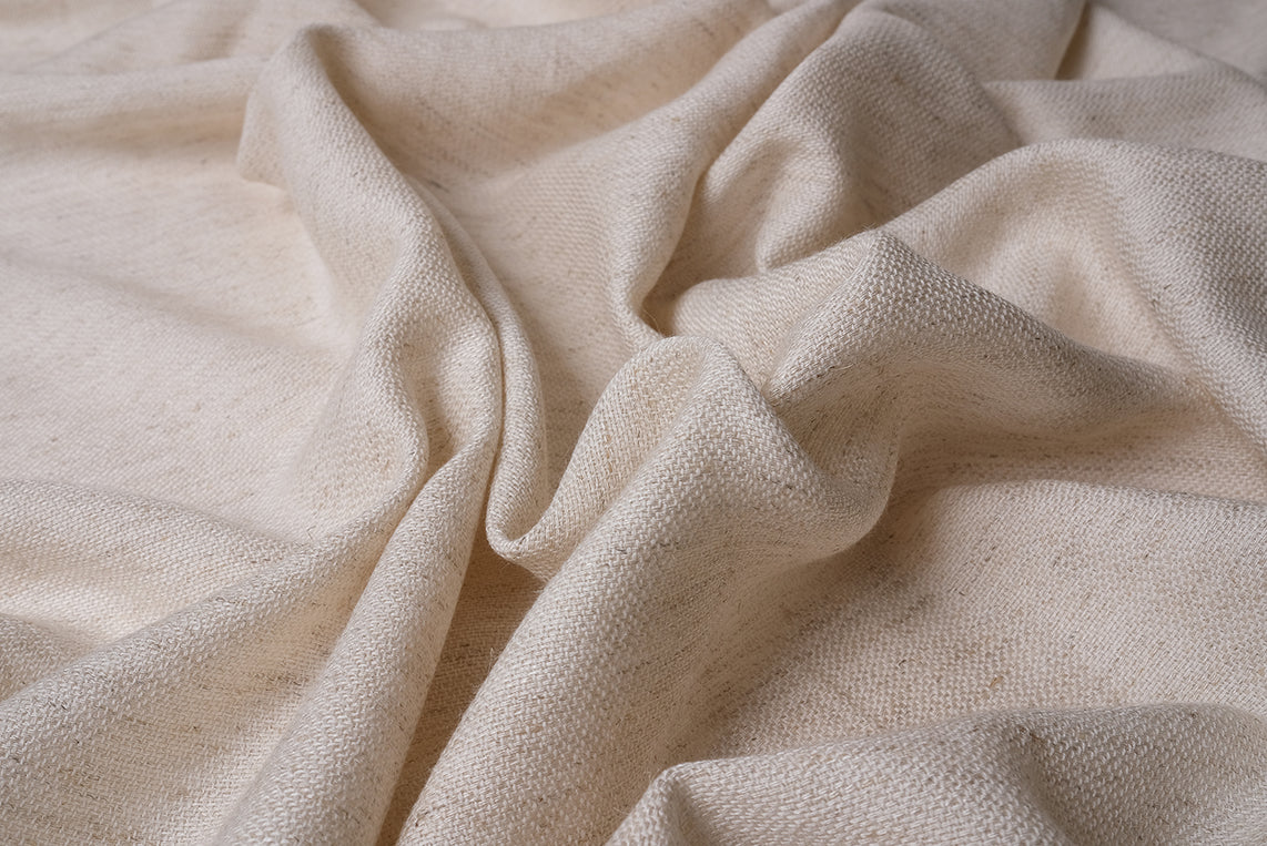 Close-up view of undyed cotton linen peshtemal fabric texture, natural and unprocessed
