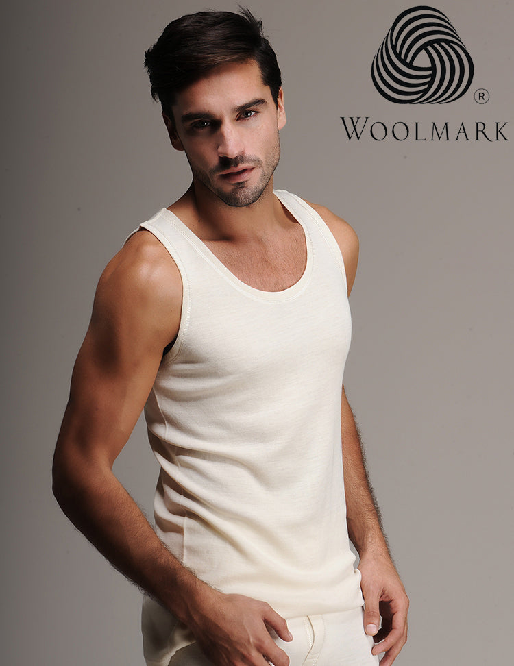 Model wearing 100% Merino wool men’s undershirt tank sleeveless, providing breathable warmth and next-to-skin comfort for sports and outdoor activities.